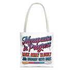Menopause in Progress tote bag with cheeky design, durable spun polyester, multiple sizes and handle color options