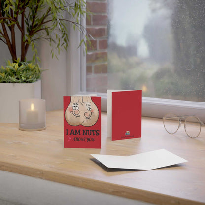 Cheeky Rude Nuts About You Greeting Card with envelope on a table, A6 size, perfect for Valentine’s Day or birthdays.