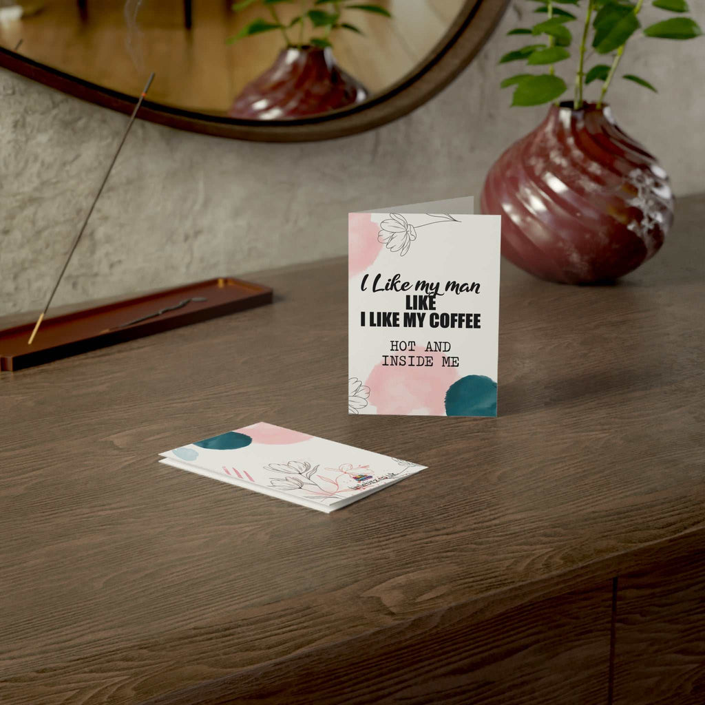 Cheeky Fun Greeting Card with playful design on a wooden table, A6 size with envelope included.