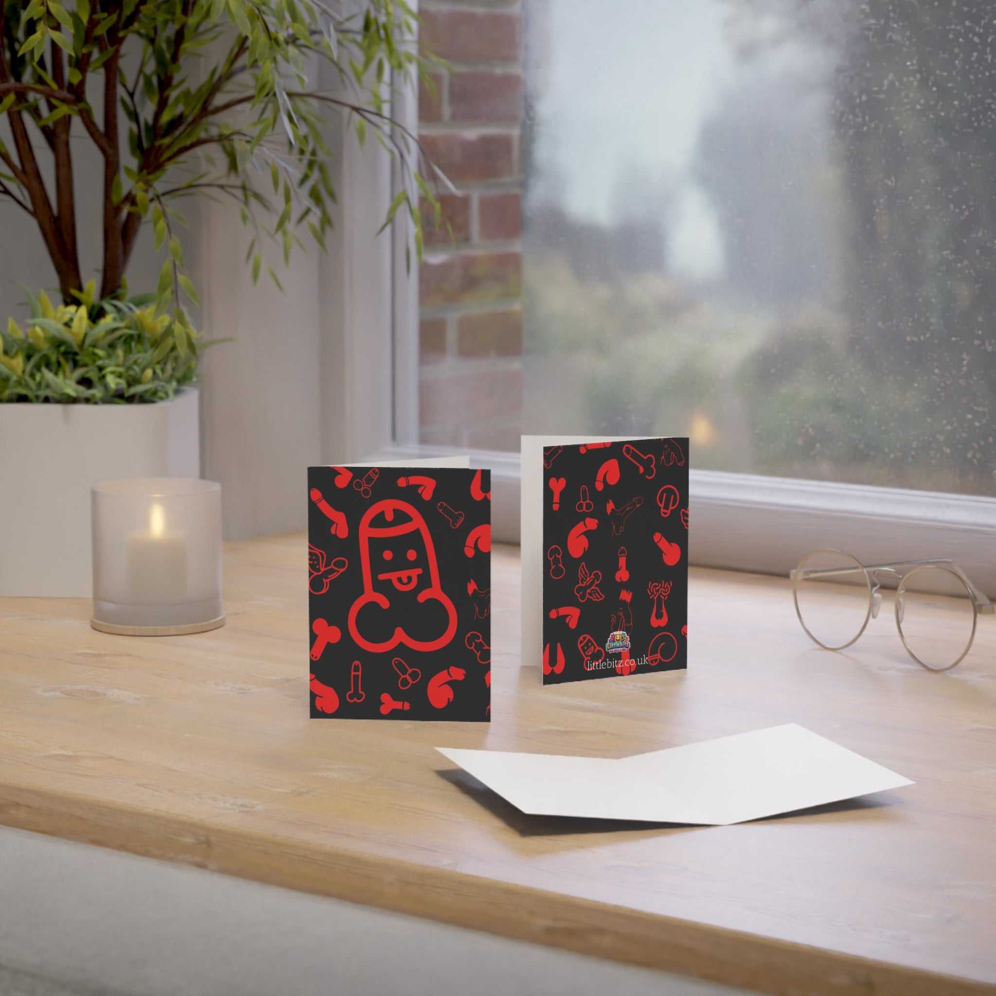 Cheeky red willy greeting card on a table, A6 size, blank inside, envelope included.
