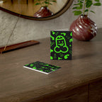 Cheeky green willy greeting card on a wooden table with a matching envelope, perfect for special occasions.
