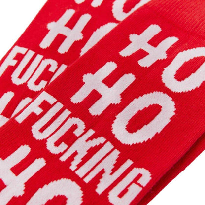 Red cotton socks with "Ho Ho Fucking Ho" text, perfect for a cheeky Christmas wardrobe addition.