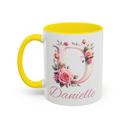 Personalised watercolour gift mug with yellow handle and interior, featuring a floral letter D and the name Danielle.