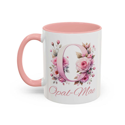 Personalised watercolour gift mug with pink handle and interior, featuring floral initial O and name Opal-Mae in elegant script