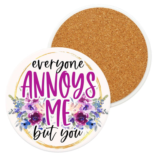 Ceramic coaster with "Everyone Annoys Me" text, floral design, non-slip cork backing.