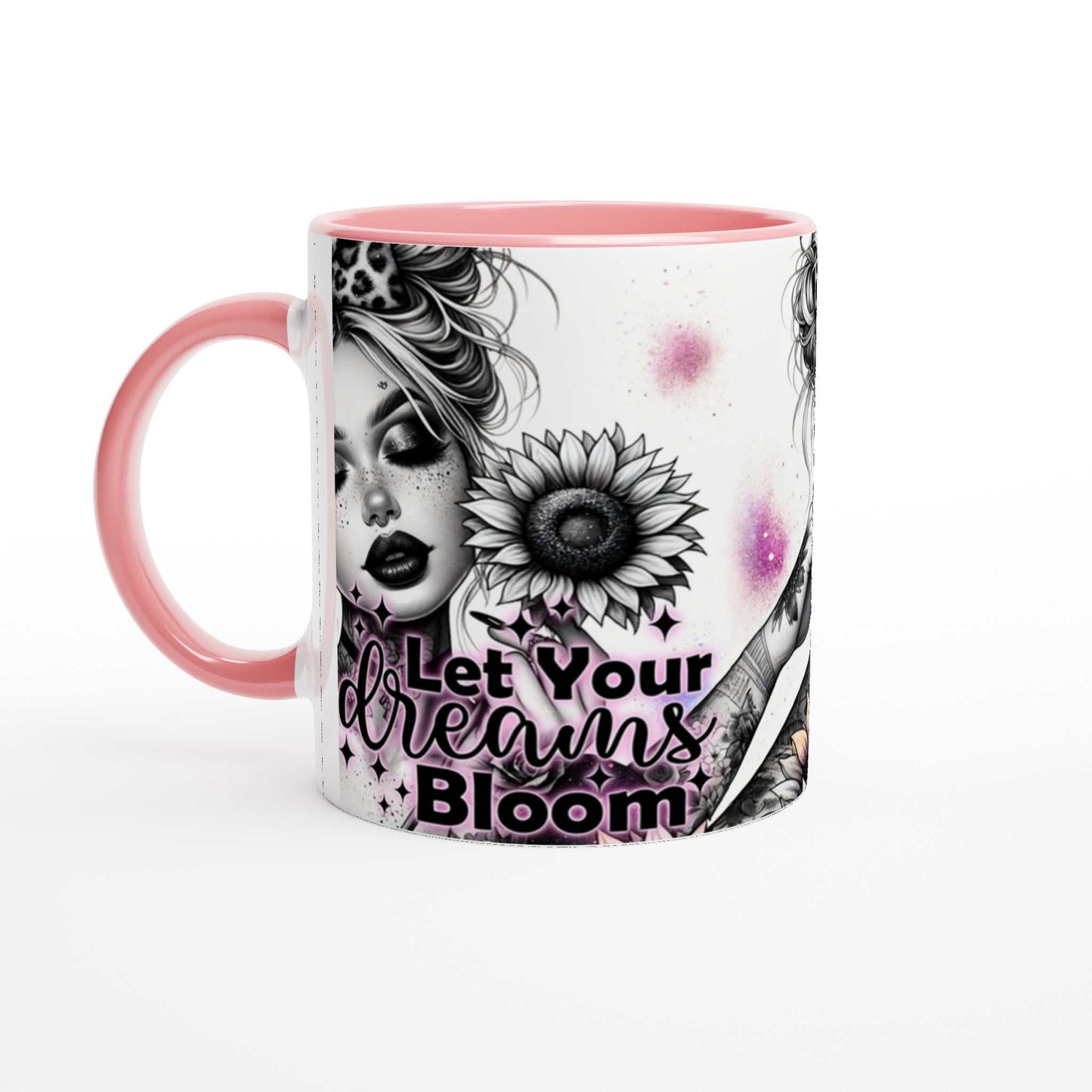 Let Your Dreams Bloom motivational coffee mug with pink rim and handle featuring a colorful design and inspirational quote.