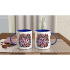 Colorful "No Fucks Given" fun mug with floral design, 11oz ceramic, blue rim and handle.