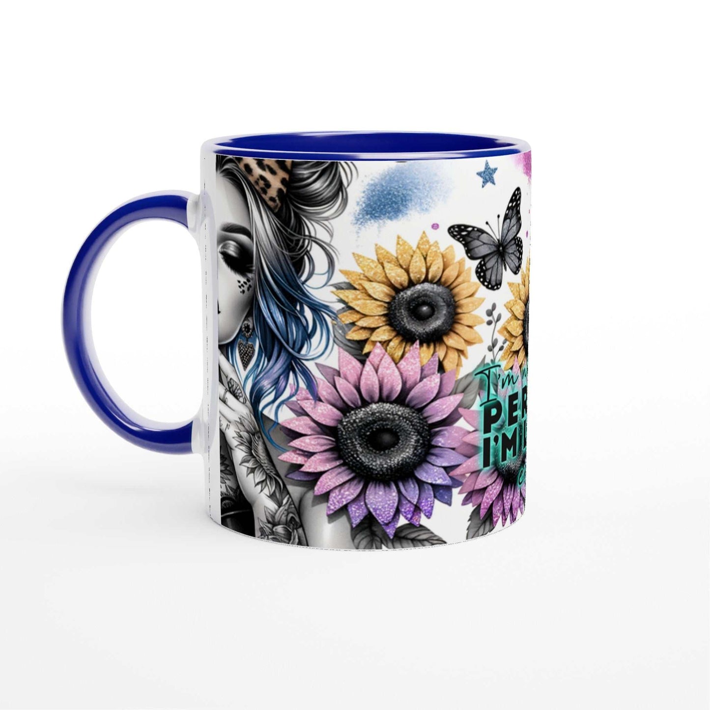 Im Not Perfect motivational coffee mug with colorful floral design, blue handle, and glossy finish.